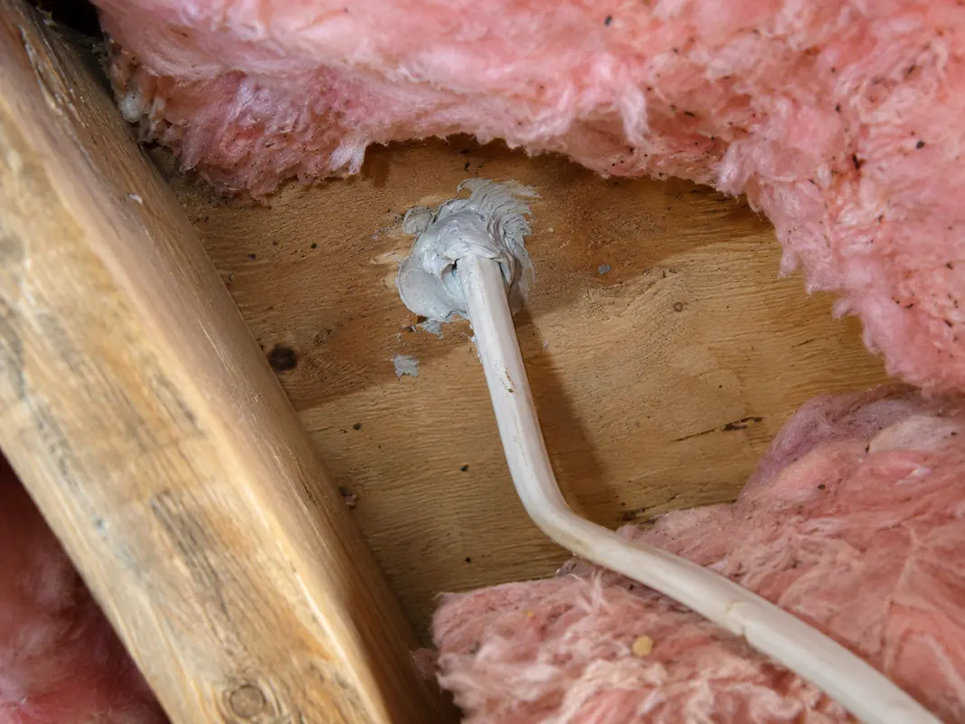 Sealed ceiling penetration below fibreglass