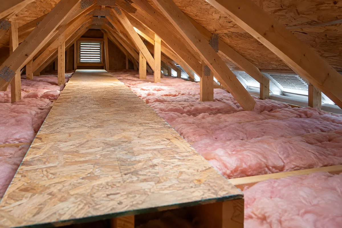 Fibreglass batts beside an attic walkway