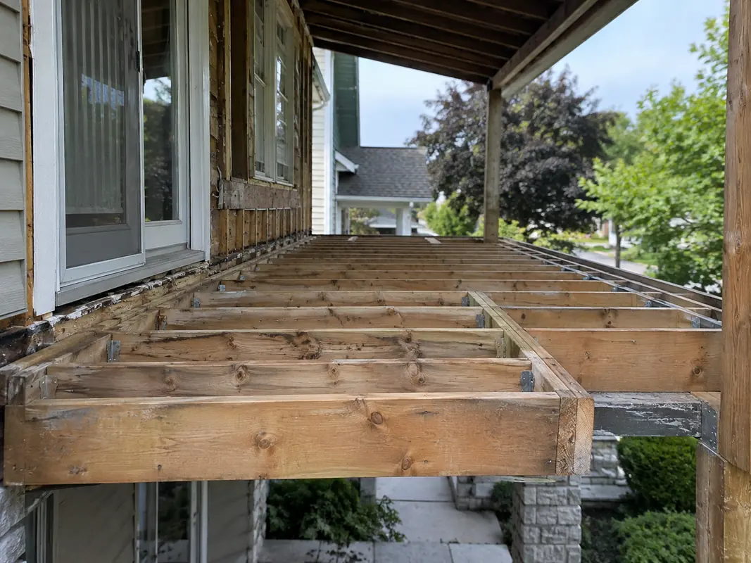 Exposed floor framing at exterior overhang