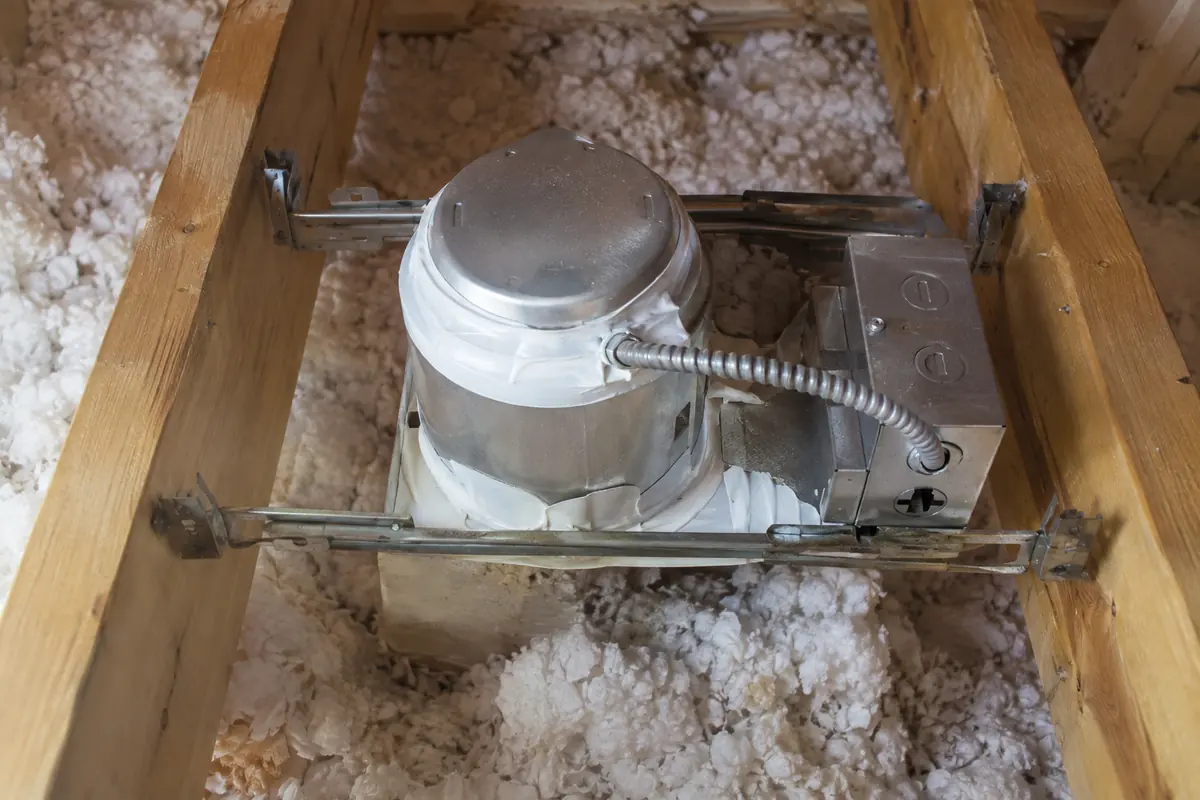Bathroom exhaust housing seen from attic